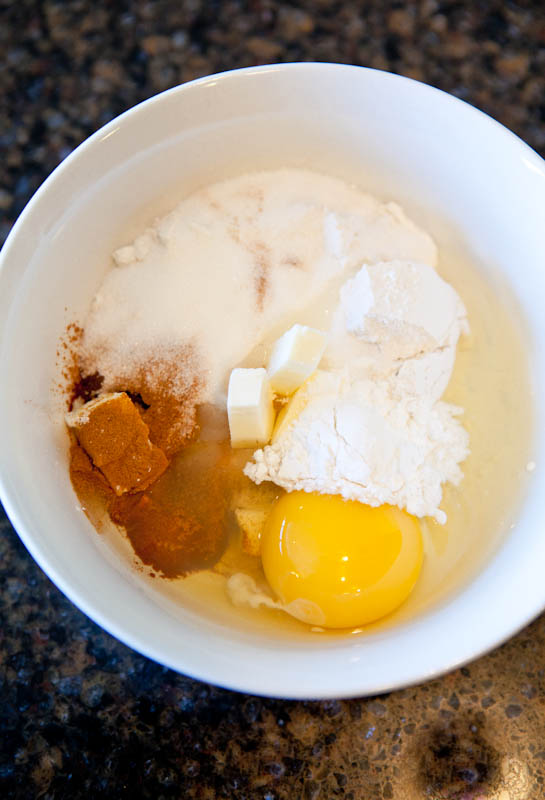Cinnamon, sugar, flour, butter, and egg in bowl