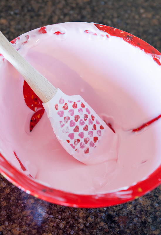 pink lemonade and condensed milk mixture in bowl
