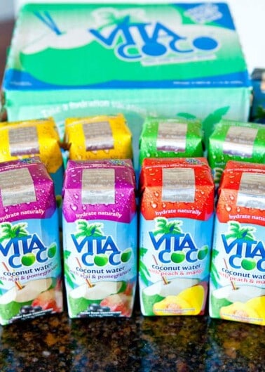 Colorful vita coco coconut water packages arranged on a countertop.
