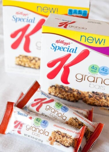 Boxes of kellogg's special k granola cereal and chocolatey peanut butter granola bars displayed on a table.