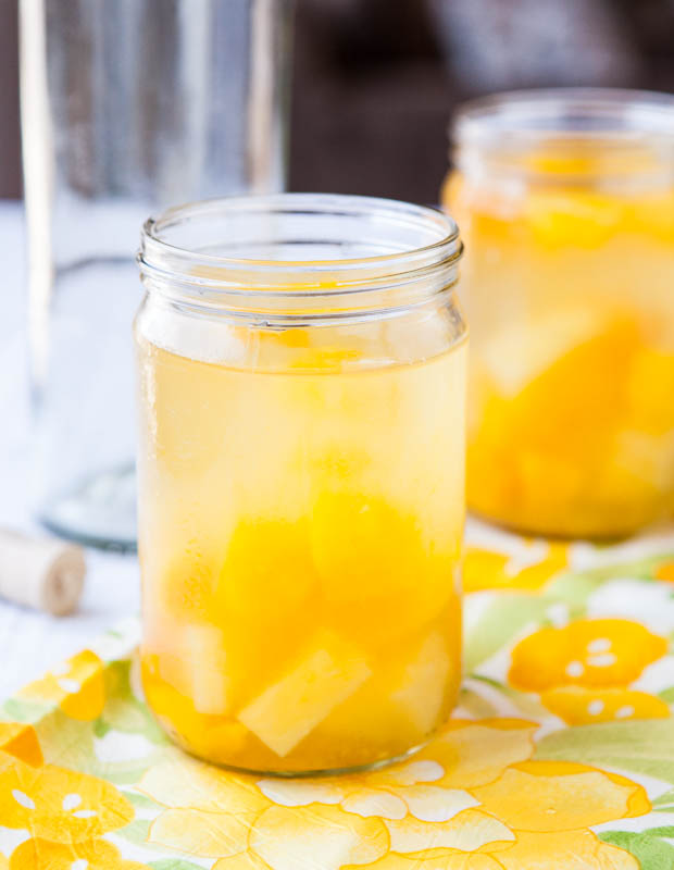 Peach Mango Pineapple White Sangria in mason jars