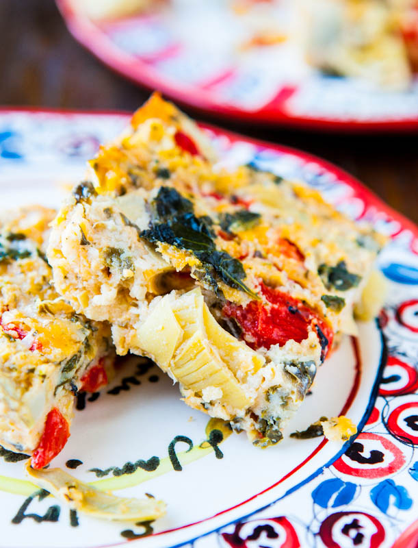 Spinach Artichoke and Roasted Red Pepper Cheesy Squares on patterned plate