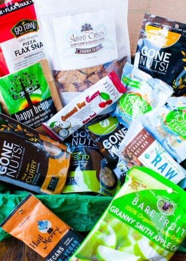 An assortment of various packaged healthy snack options displayed on a surface.