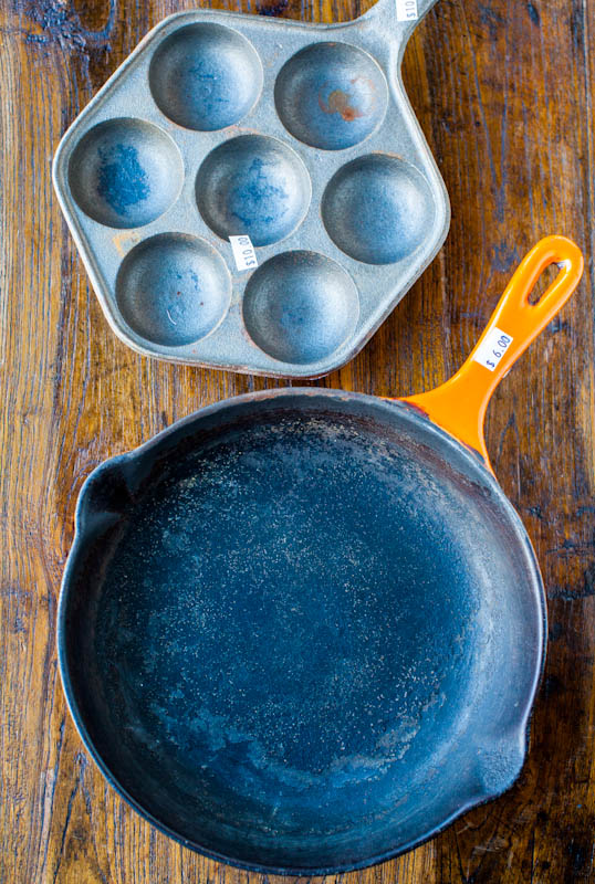 Vintage cast iron pan and pan with divets in it