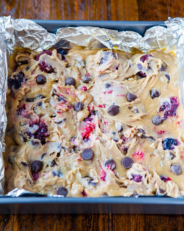uncooked Chocolate Chip Cherry Bars in square baking pan