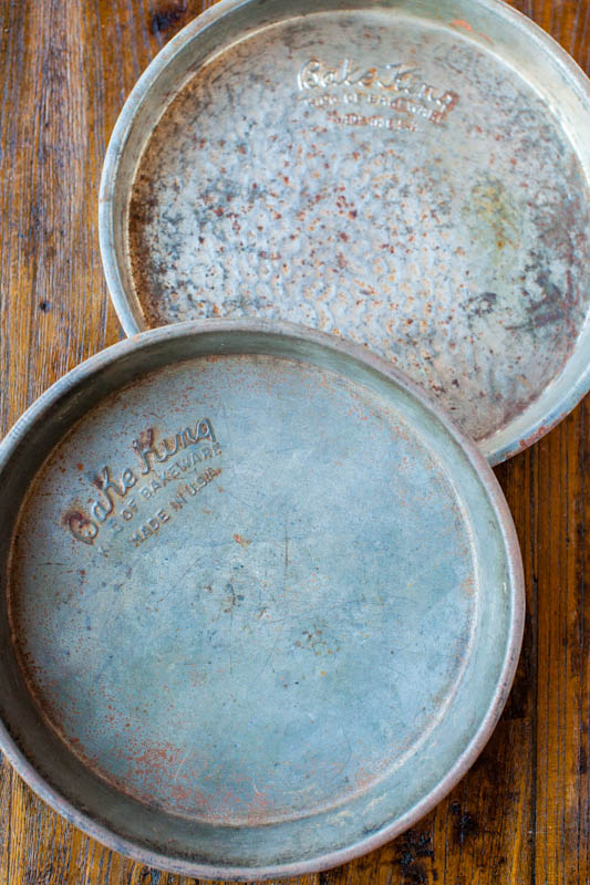 two old rusted baking pans
