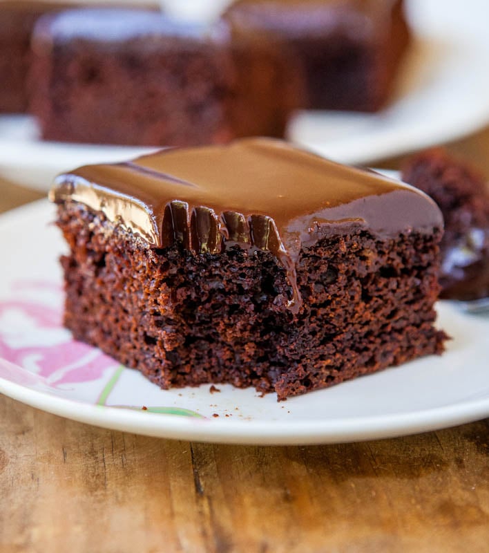 The Best Chocolate Cake with Chocolate Ganache on a white plate 