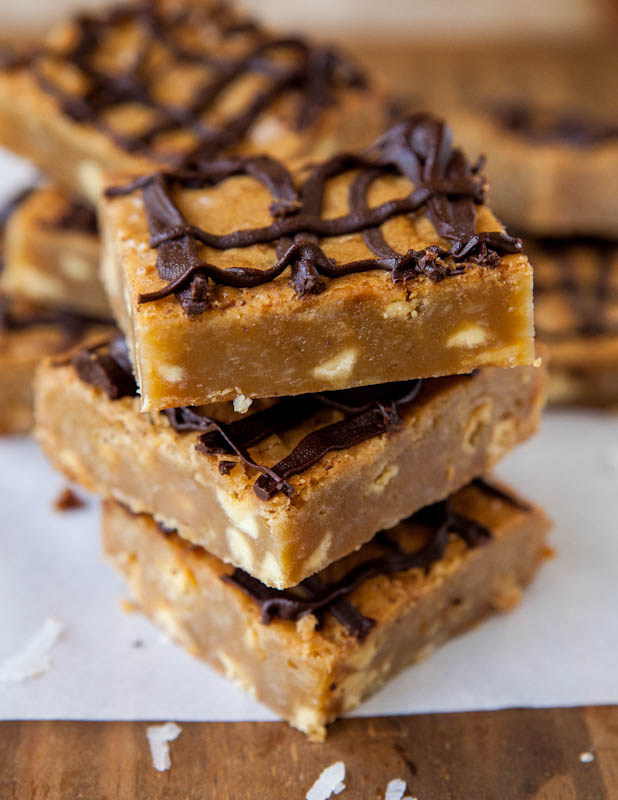 Coconut White Chocolate Chip Blondies with Semi-Sweet Chocolate Drizzle stacked