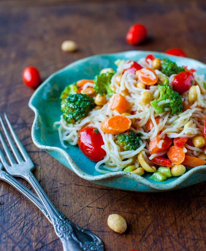 Peanut Noodles with Mixed Vegetables and Peanut Sauce in blue bowl