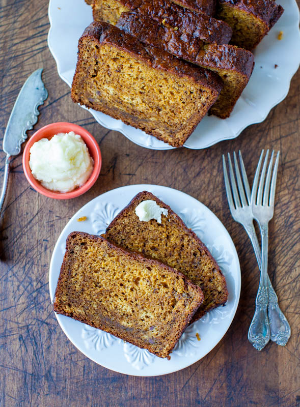 Over head of sliced Pumpkin Banana Bread with two pieces on white plate