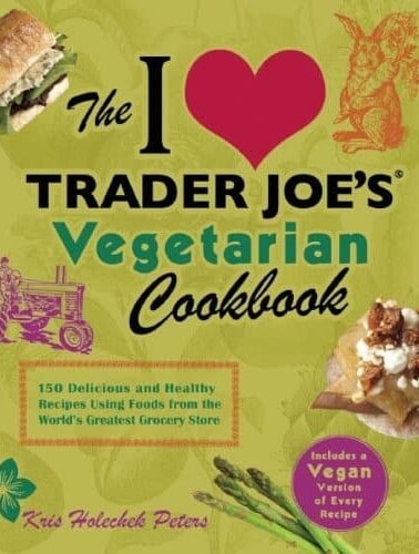 The trader joe's vegetarian cookbook cover featuring heart symbol, illustrations of food, and text announcing 150 recipes and a vegan version section.