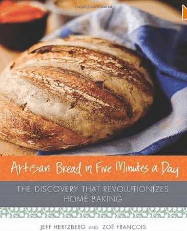 A hardcover book titled "artisan bread in five minutes a day" by jeff hertzberg and zoë françois, showcasing a freshly baked loaf of bread.