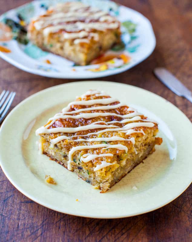 Banana Zucchini Pudding Cake with Vanilla Browned Butter Glaze on yellow plate