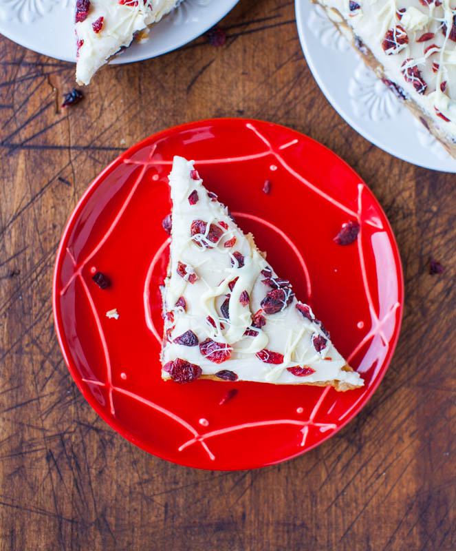 overhead view of a copycat starbucks cranberry bliss bar on a red plate 