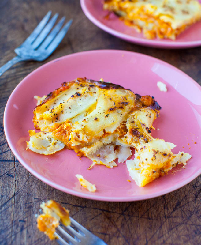 Pumpkin and Cheesy Baked Potato Casserole on pink plate