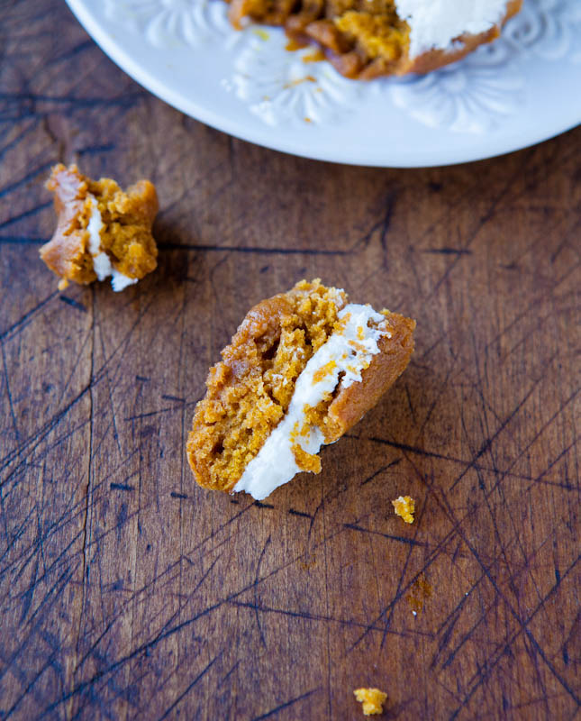 Pumpkin Whoopie Pies — Soft and tender pumpkin cookies with a thick layer of sweet buttercream sandwiched between them will make you scream "Whoopie!" for one of these fun pies. They're easy and fast to make, moist, and rich!