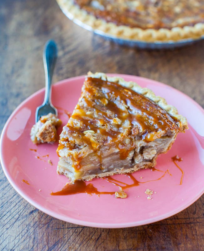 slice of Caramel Apple Crumble Pie on pink plate with fork