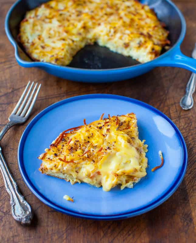 A blue plate with Creamy and Crispy Hash Browns Frittata