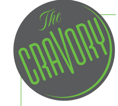 Logo of "the cravory" featuring stylized green text on a gray circular background.