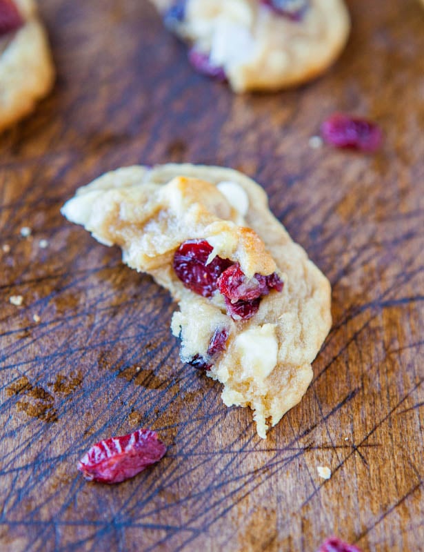 half of a white chocolate dried cranberry cookie
