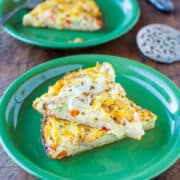 Two slices of frittata on a green plate.