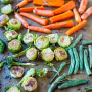 Assorted roasted vegetables on a baking sheet.