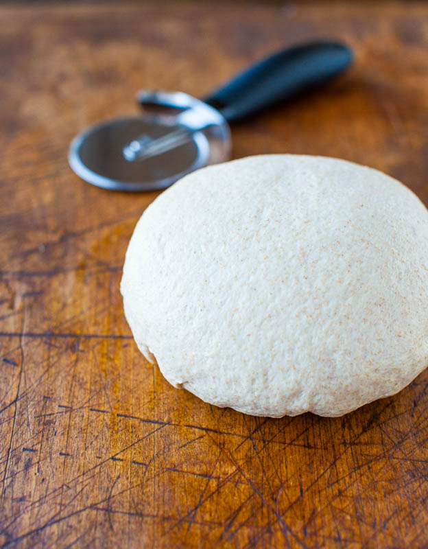 1-Hour Whole Wheat Pizza Dough — The dough is soft, chewy, thick and hearty, versatile, and EASY! Simply combine all ingredients in a mixing bowl, knead for about 8 minutes, wait an hour, and bake it off! 