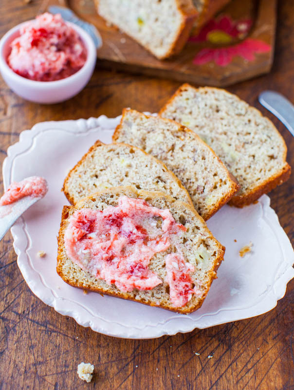 four slices of Buttermilk Banana Bread smeared with strawberry butter