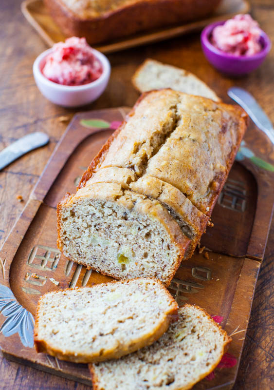 A sliced loaf of Browned Butter Buttermilk Banana Bread with Strawberry Butter