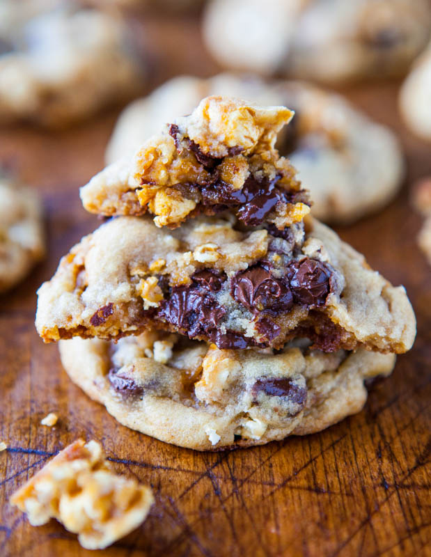 Caramel Corn Chocolate Chip Cookies stacked with one in half showing gooey chocolate 