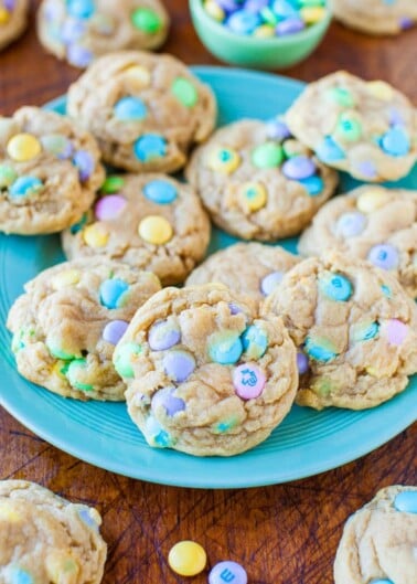 A plate of homemade cookies with colorful candy pieces mixed in.