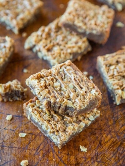 Homemade cereal bars on a wooden cutting board.