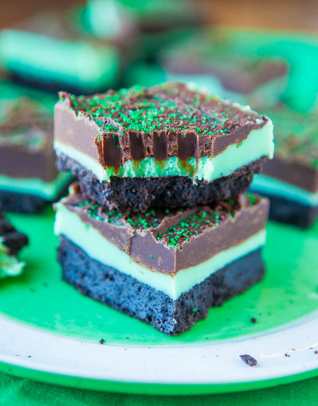 Close up of two stacked Mint and Chocolate Fudge Oreo Bars with bite taken out of one bar