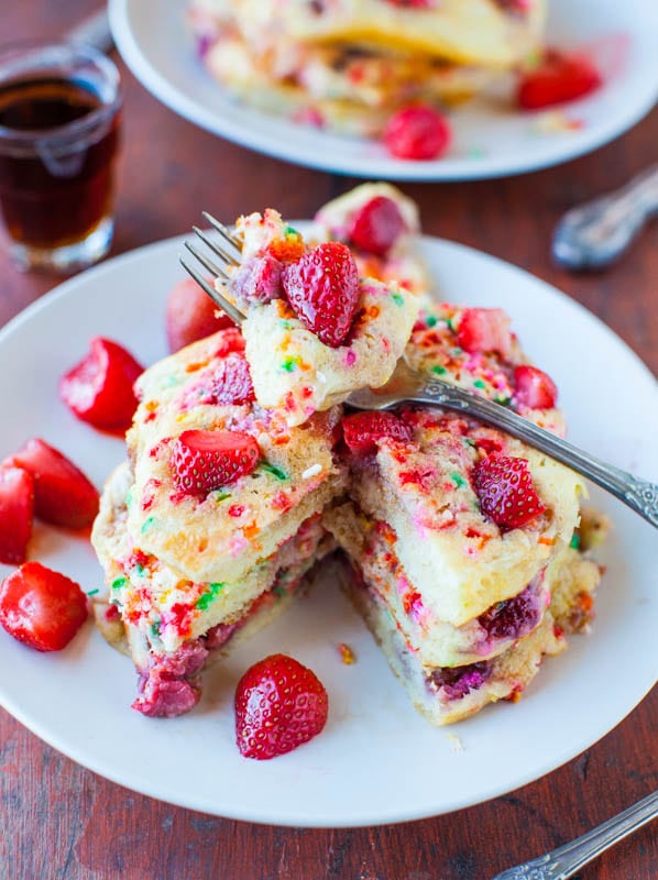 Strawberry and Sprinkles Buttermilk Pancakes stacked on plate