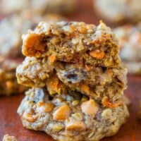 A close-up of a stack of freshly baked cookies with butterscotch chips.