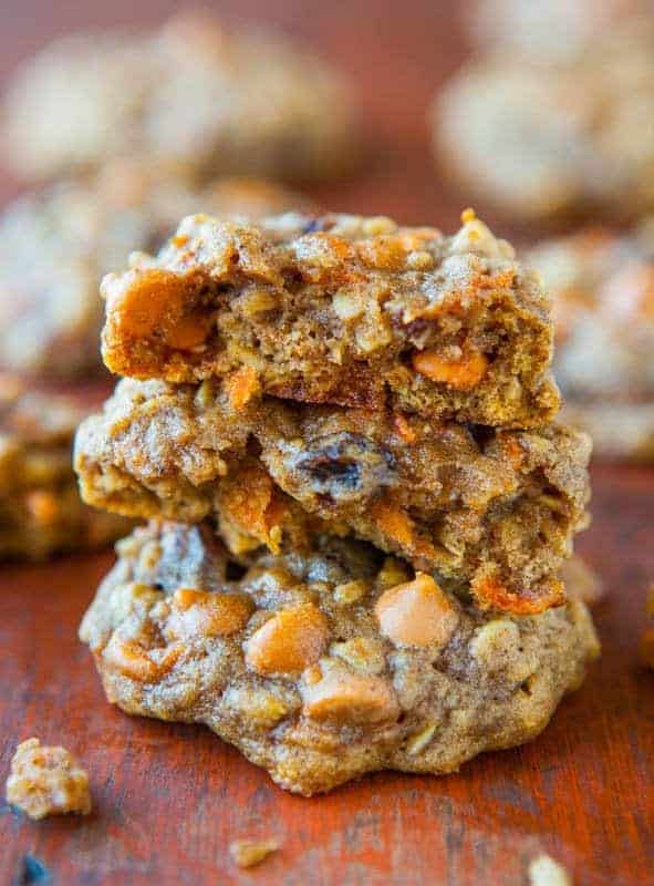 A stack of Soft and Chewy Spiced Carrot Cake Cookies on top of wooden table