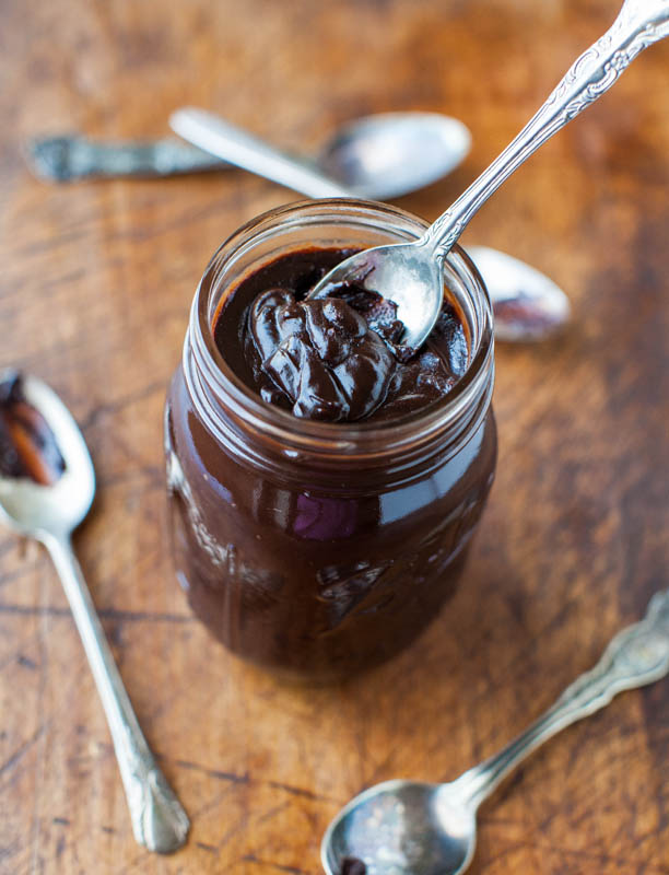 homemade hot fudge in glass jar with spoon