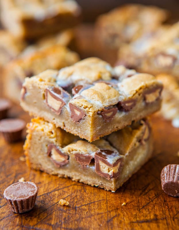 Two stacked Peanut Butter Cup Cookie Dough Crumble Bars