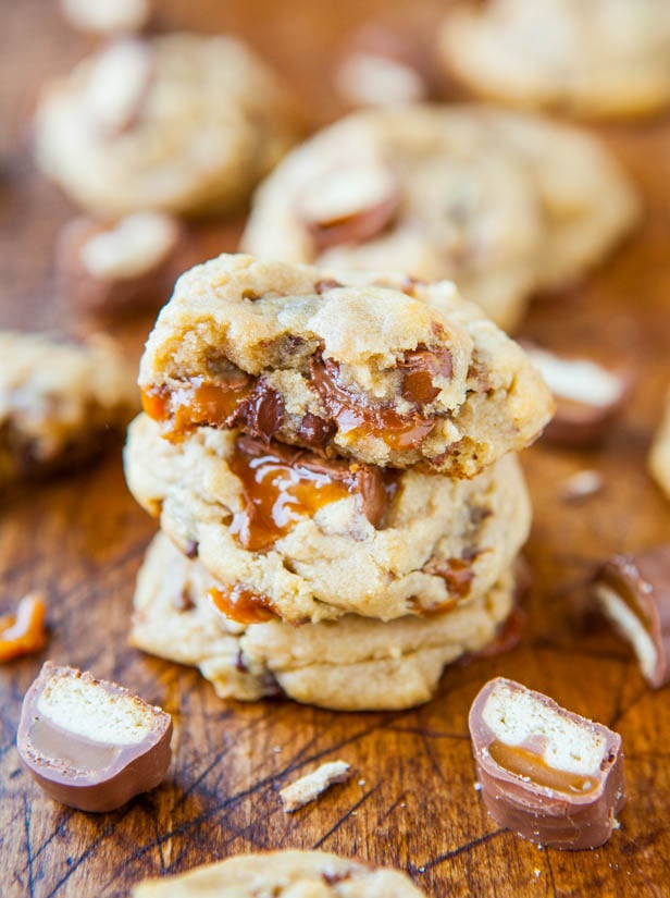 Twix Cookies — My favorite chocolate chip cookies, but stuffed with Twix! Soft, chewy, and look at all that gooey caramel!