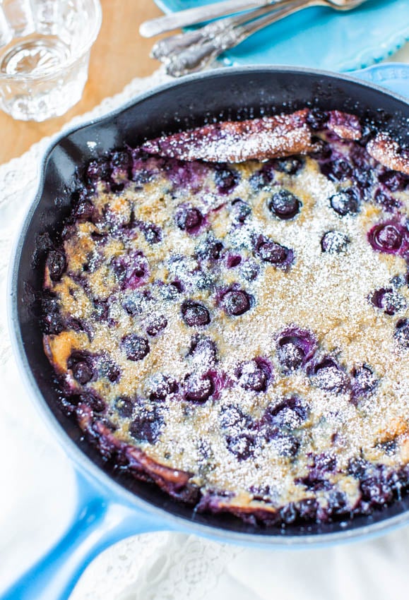 blueberry dutch baby pancake in a cast iron skillet