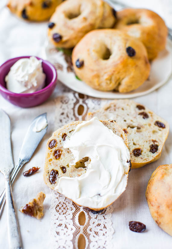 cinnamon raisin bagel cut in half and smeared with cream cheese