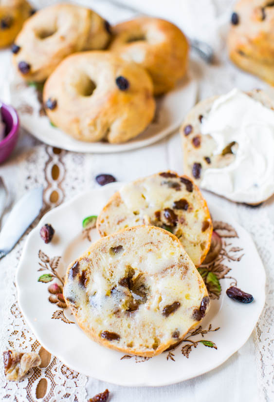 homemade cinnamon raisin bagels on two floral plates