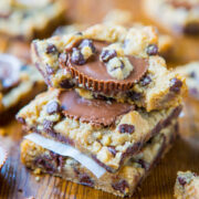 Stack of chocolate chip cookie bars with a peanut butter cup center.