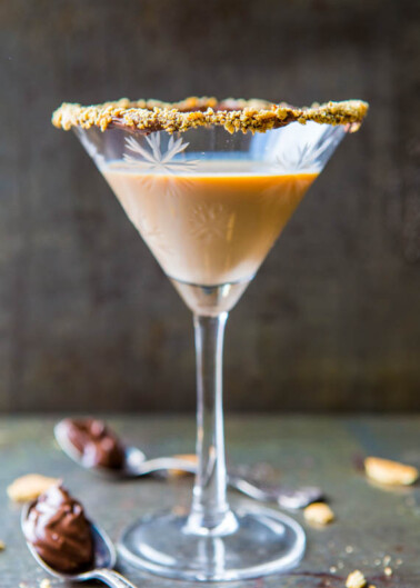 Chocolate martini with a crushed biscuit rim served in a stemmed glass.