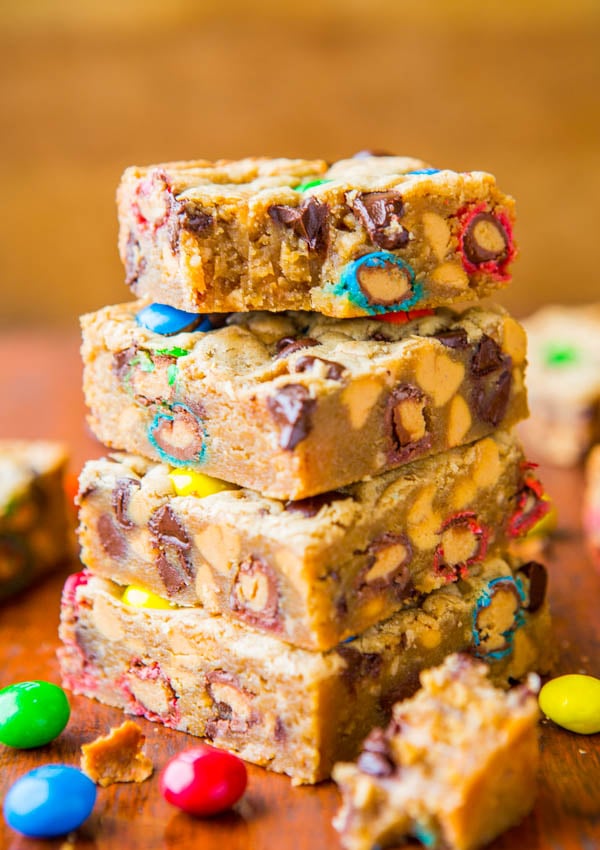 Triple Peanut Butter Monster Cookie Bars - Soft, gooey bars loaded with M&Ms, chocolate and made for serious peanut butter lovers! So good!