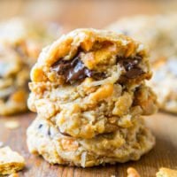 A stack of chewy chocolate chip cookies with visible chunks of chocolate and nuts.