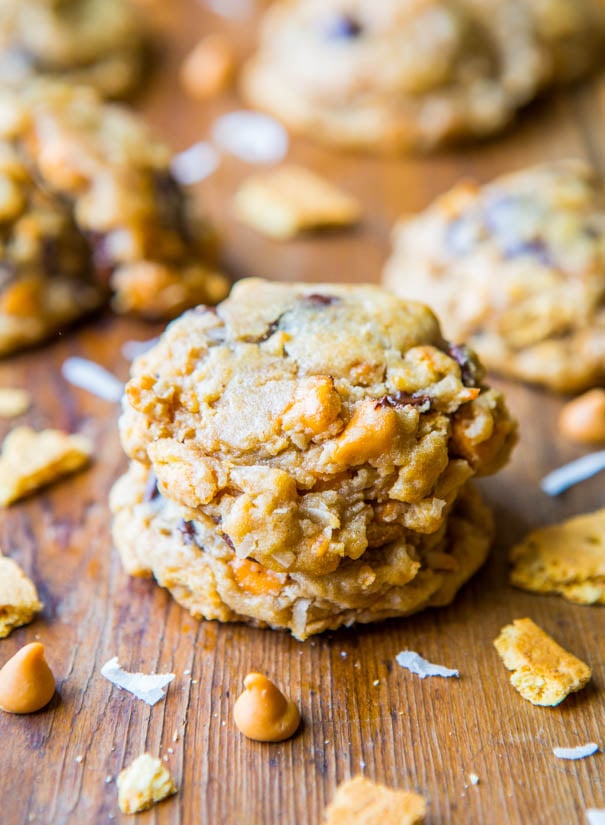 7 Layer Cookies surrounded by coconut flakes and butterscotch chips