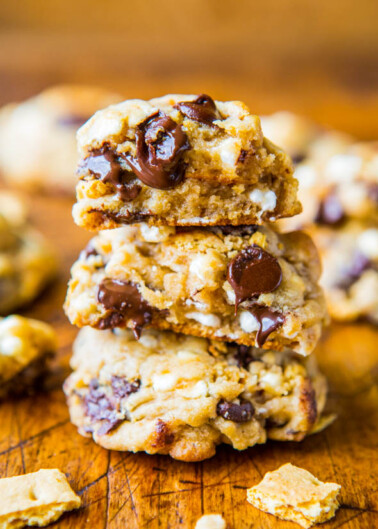 Stack of chocolate chip cookies with visible chunks of chocolate and cookie pieces.