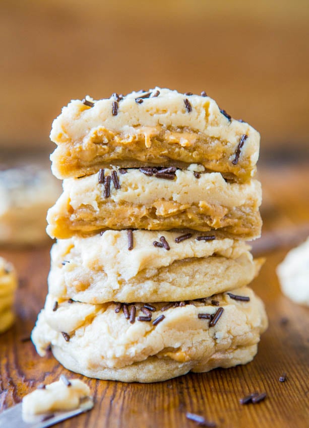 stack of four frosted peanut butter chip cookies