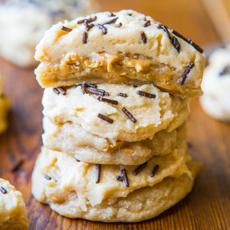 A stack of cookies with caramel filling and chocolate sprinkles on top.